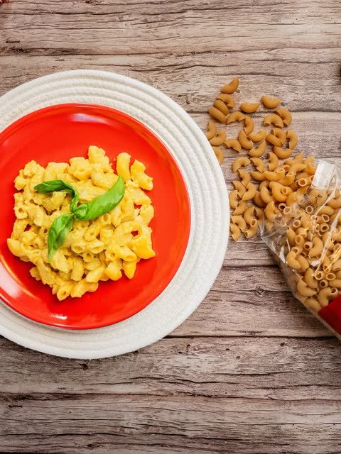 A plate of creamy Aladey Macaroni with basil